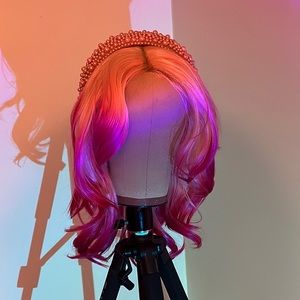 Synthetic baby pink and hot pink wig